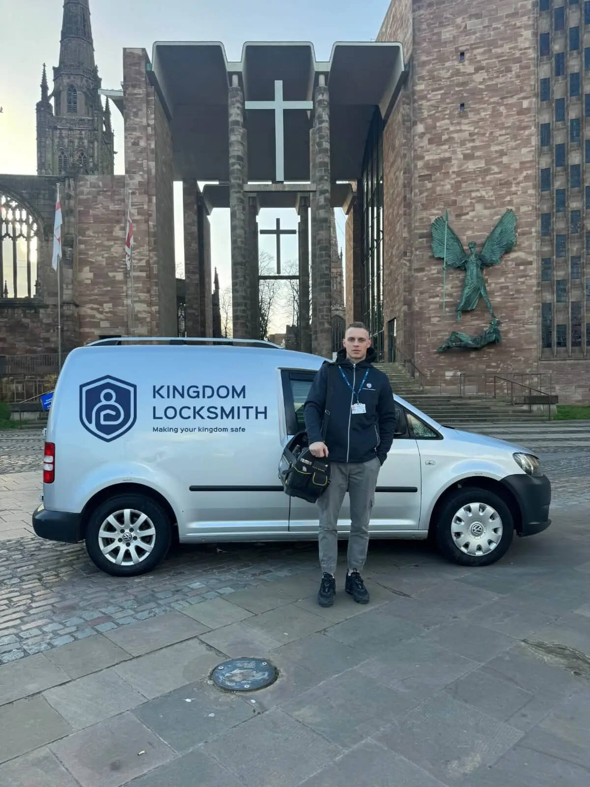Kingdom engineer opening a door lock during an emergency call-out